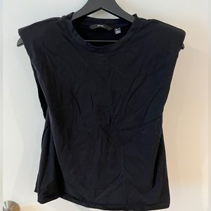 Sleeveless top with shoulder pads
